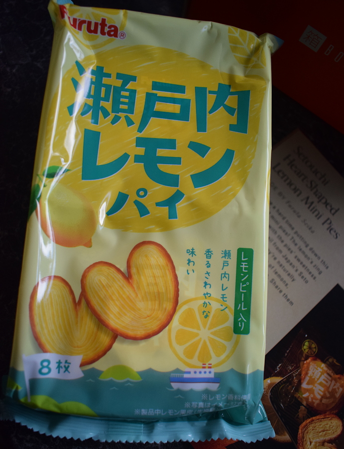 a pack of lemon pastry swirls next to a leaflet describing them